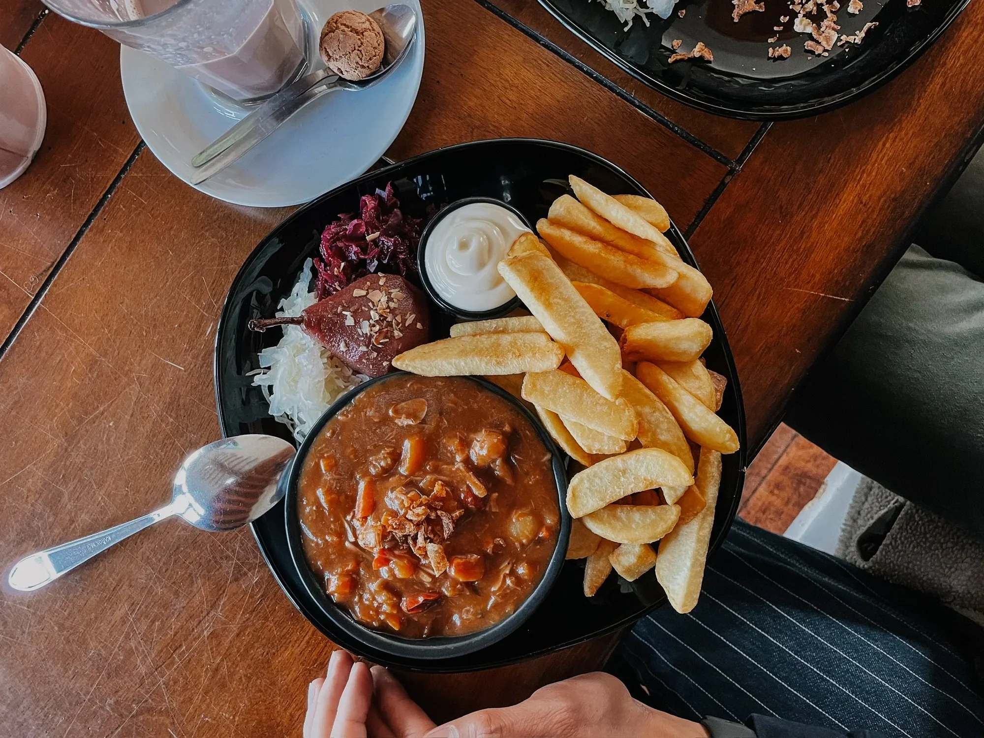 traditional dutch vegan jackfruit stew with pickled cabbage, mayonnaise and fries