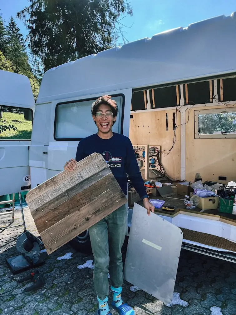 frank holding old wood for the back doors
