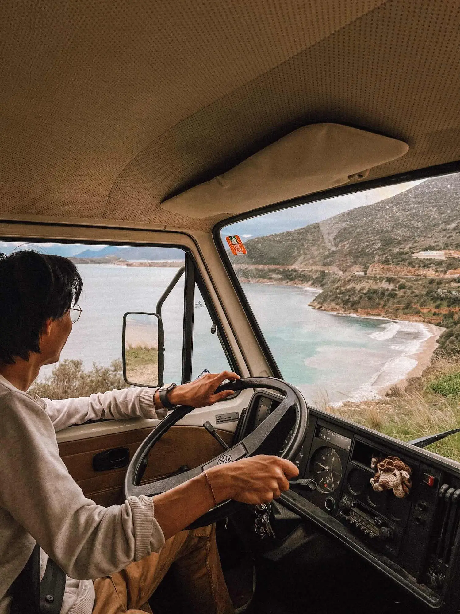 a road winding through the greek landscape