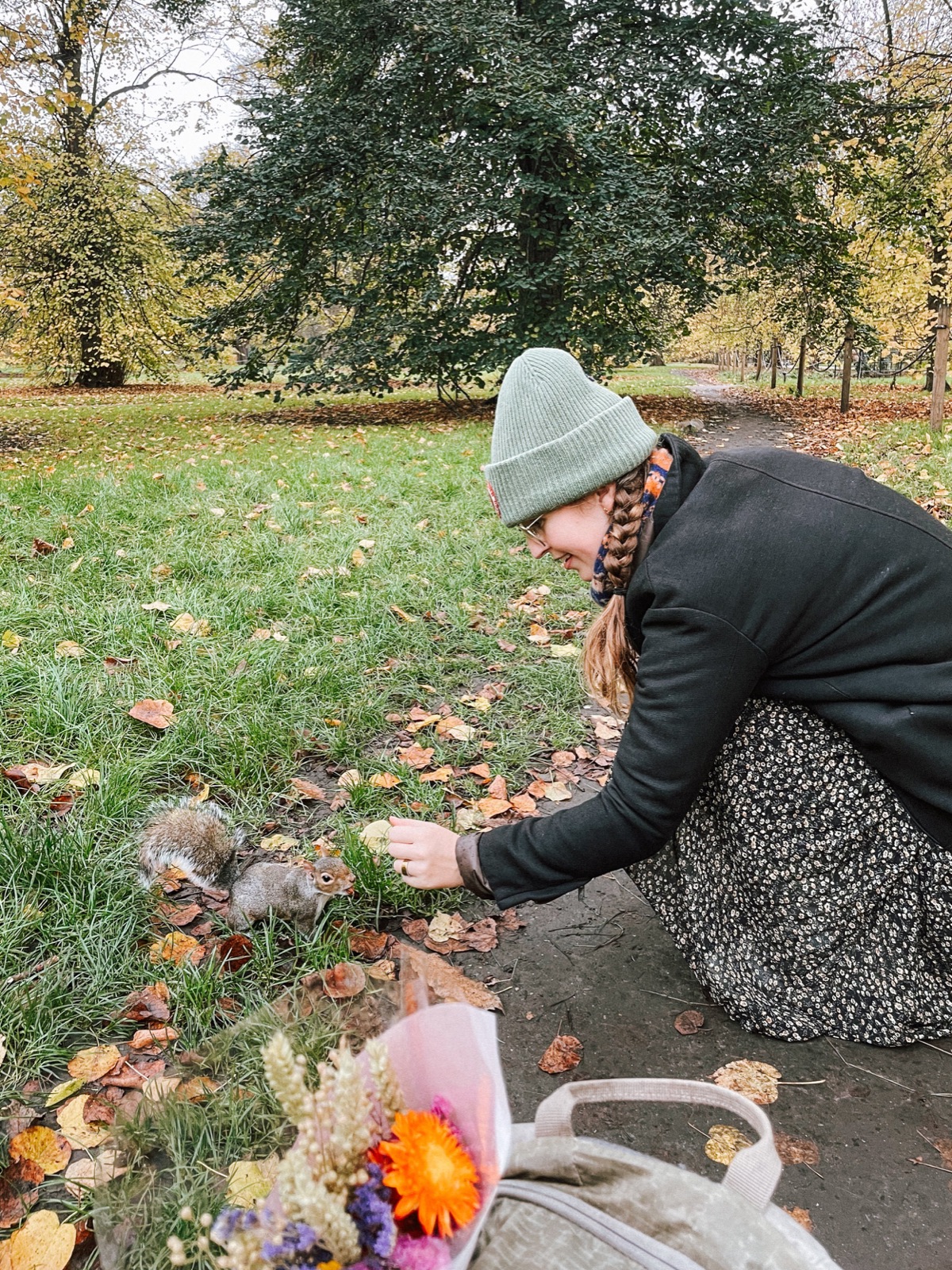 evelyne trying to make friends with a grey squirrel