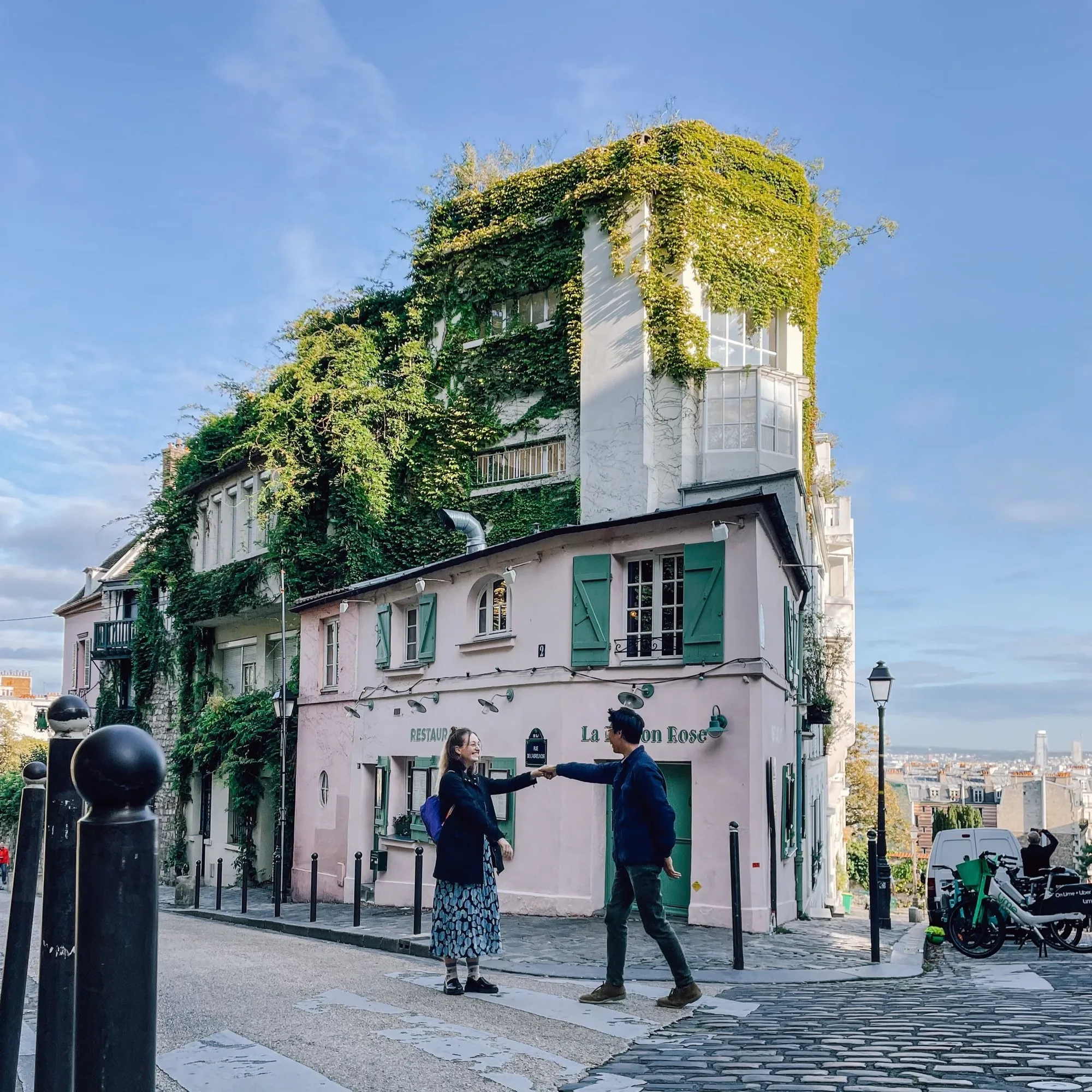 behind place du tertre lies le maison rose wrapped in ivy