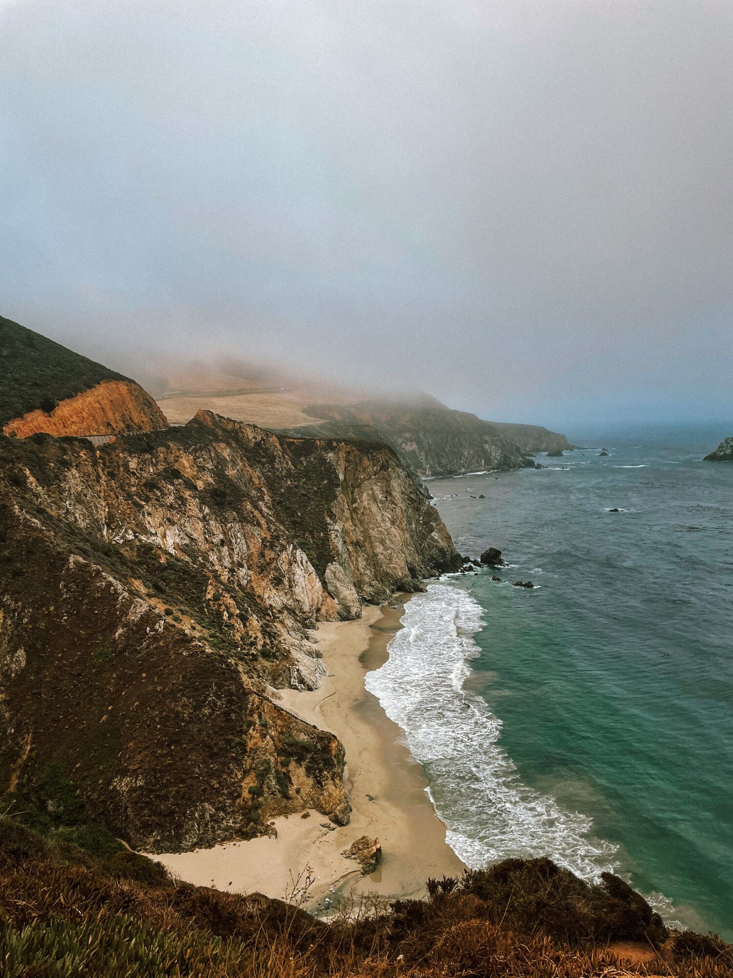 yellow sandy beaches, blue water… and a cloudy sky
