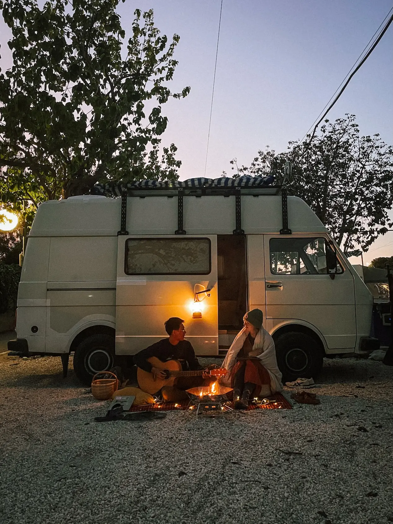 a campfire next to humbär at the campground