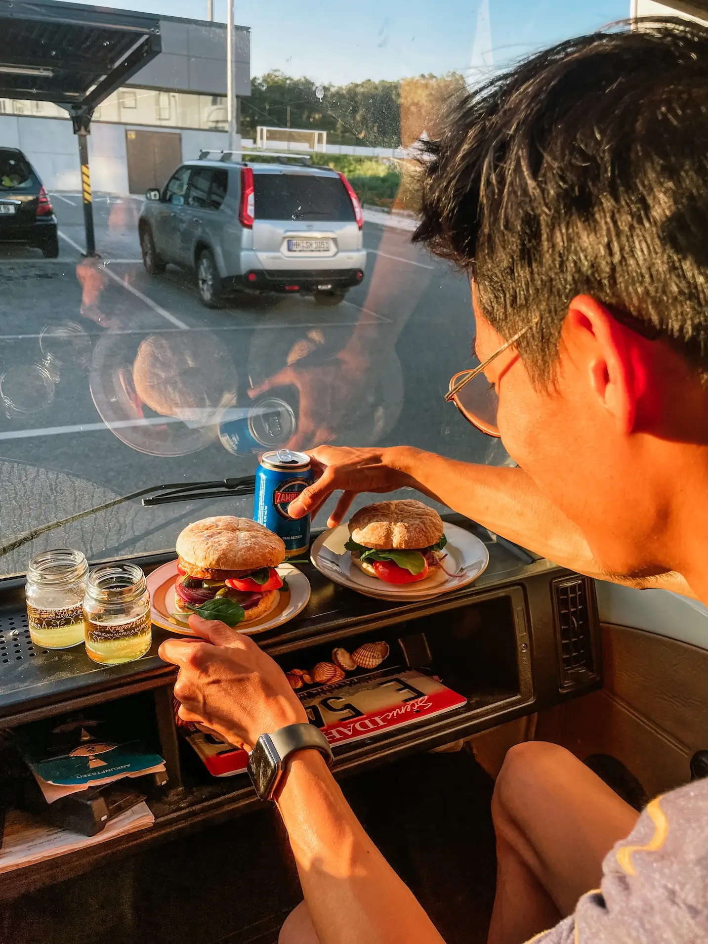 frank eating dinner in the van on a parking lot