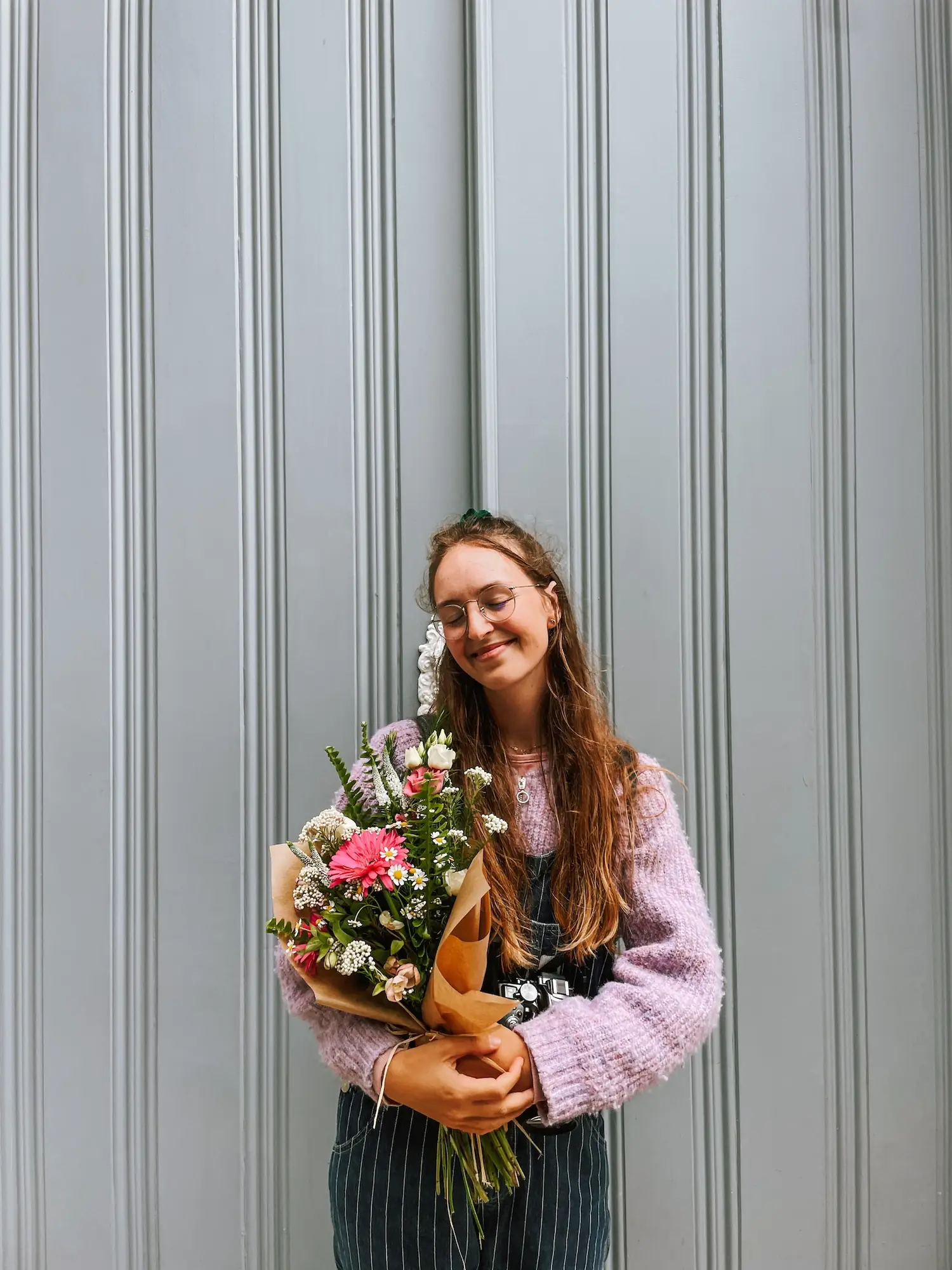 evelyne holding a bouquet of flowers