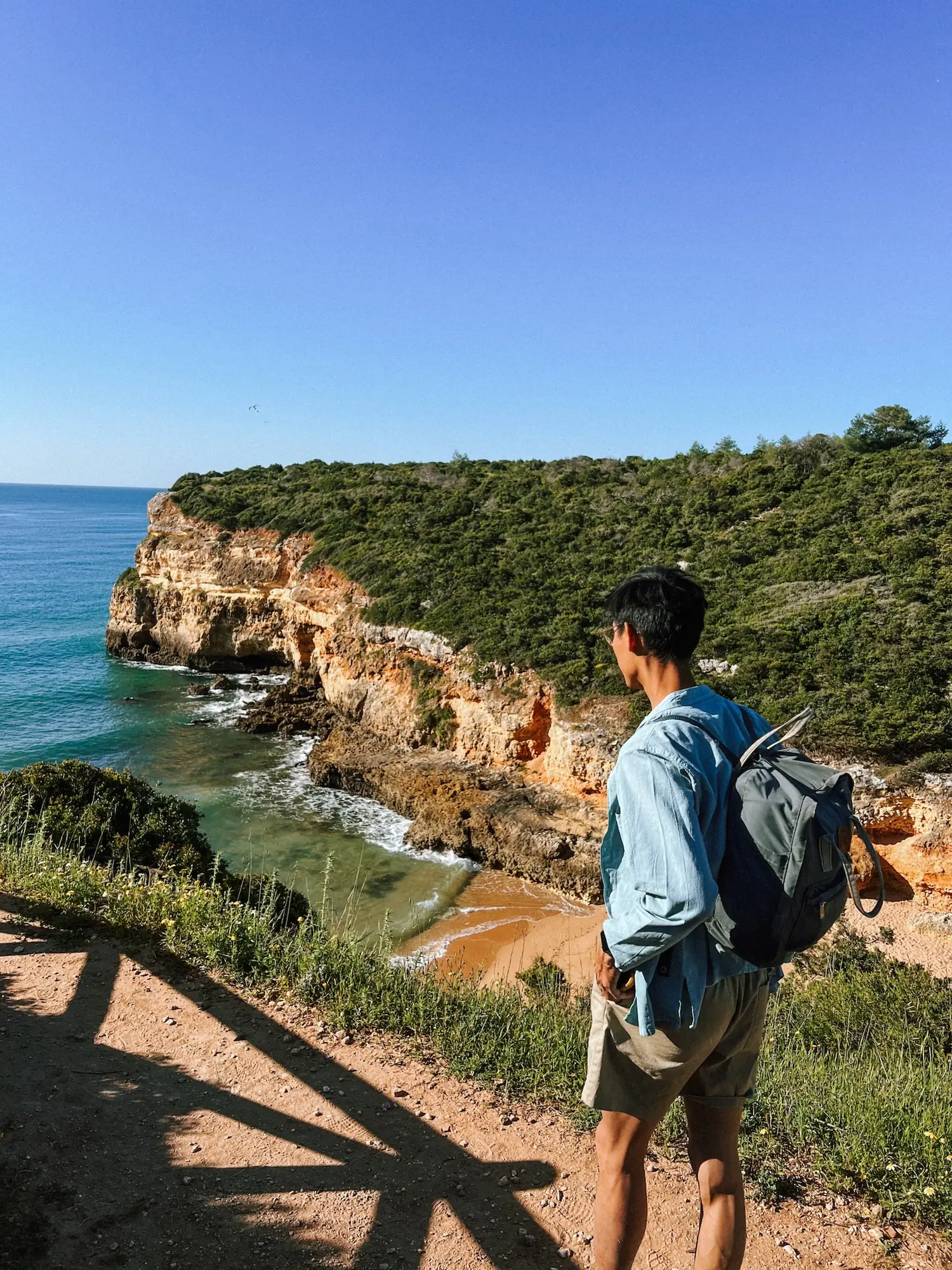 frank on a boardwalk above the algarve cliffs