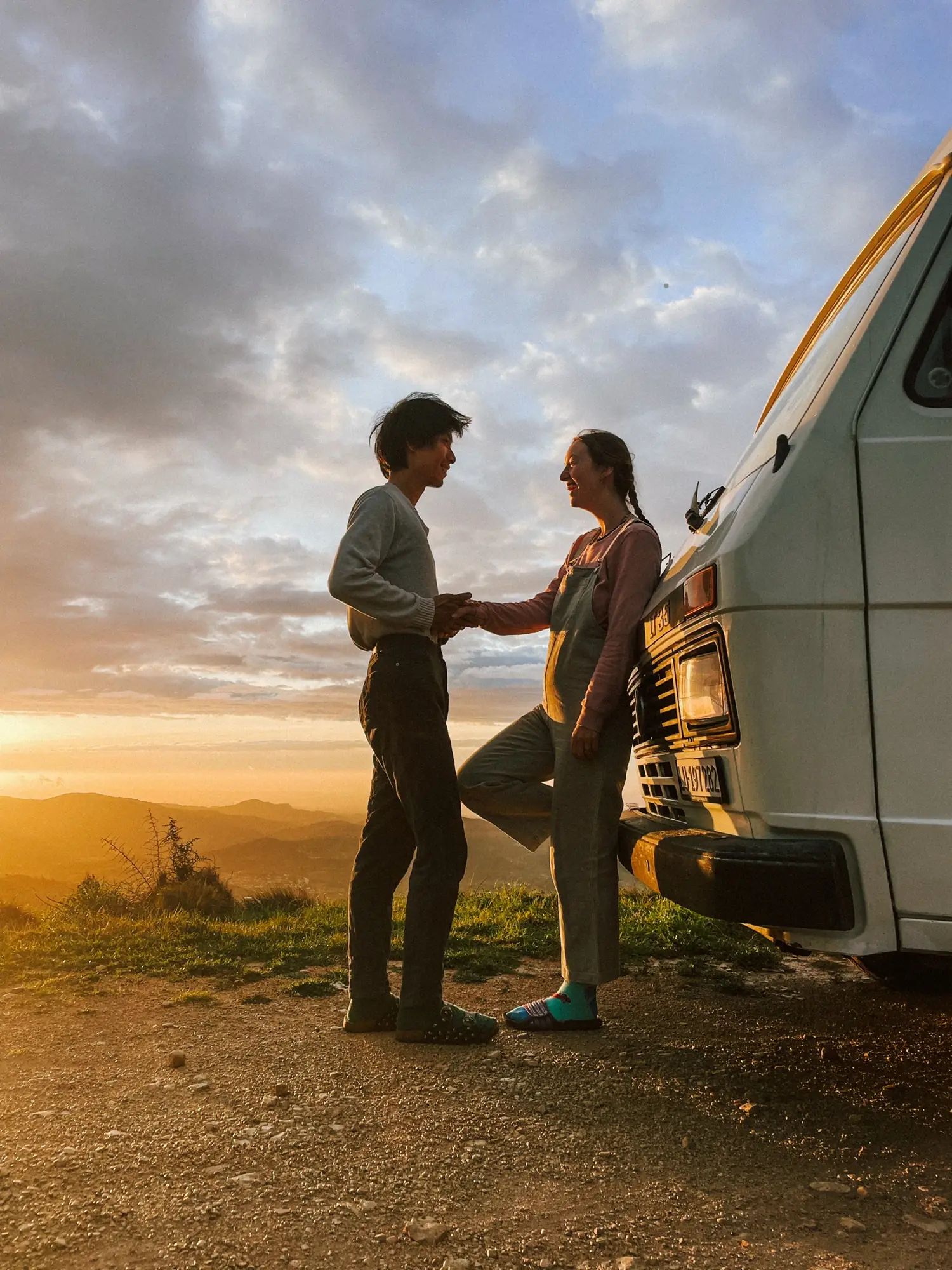 frank and evelyne next to humbär at sunset