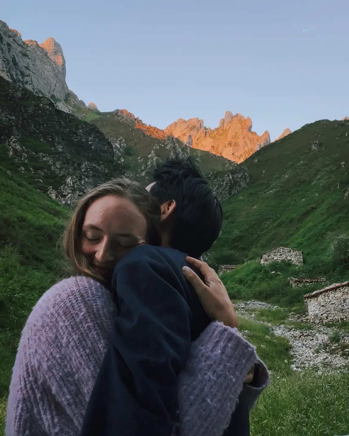 frank and evelyne hugging at sunset in the mountains