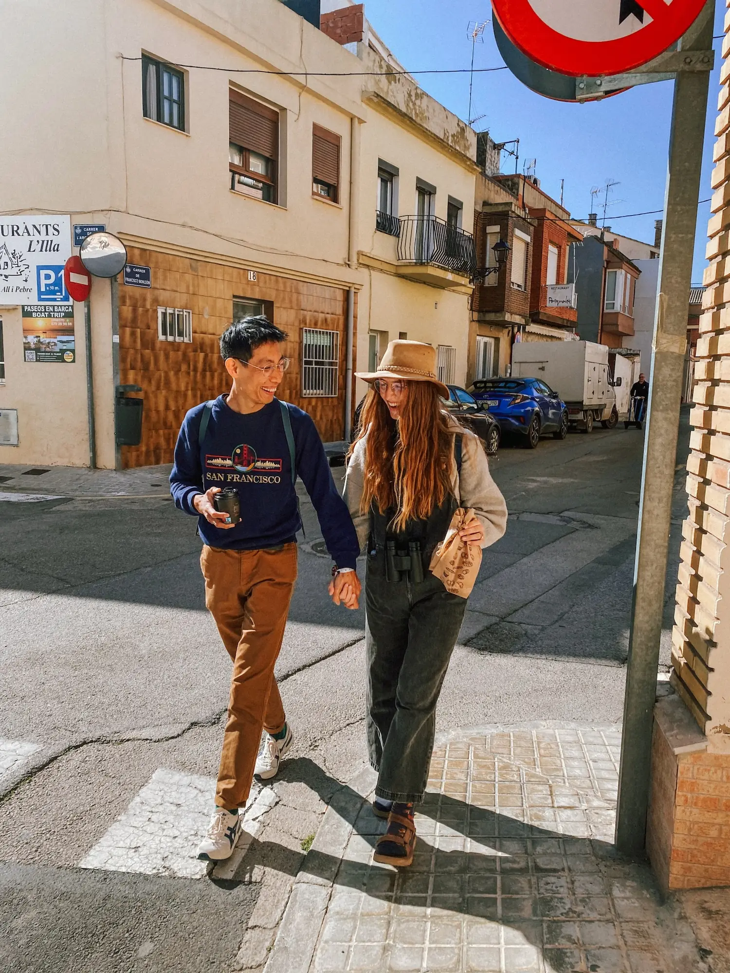 frank and evelyne walking through a suburb of valencia