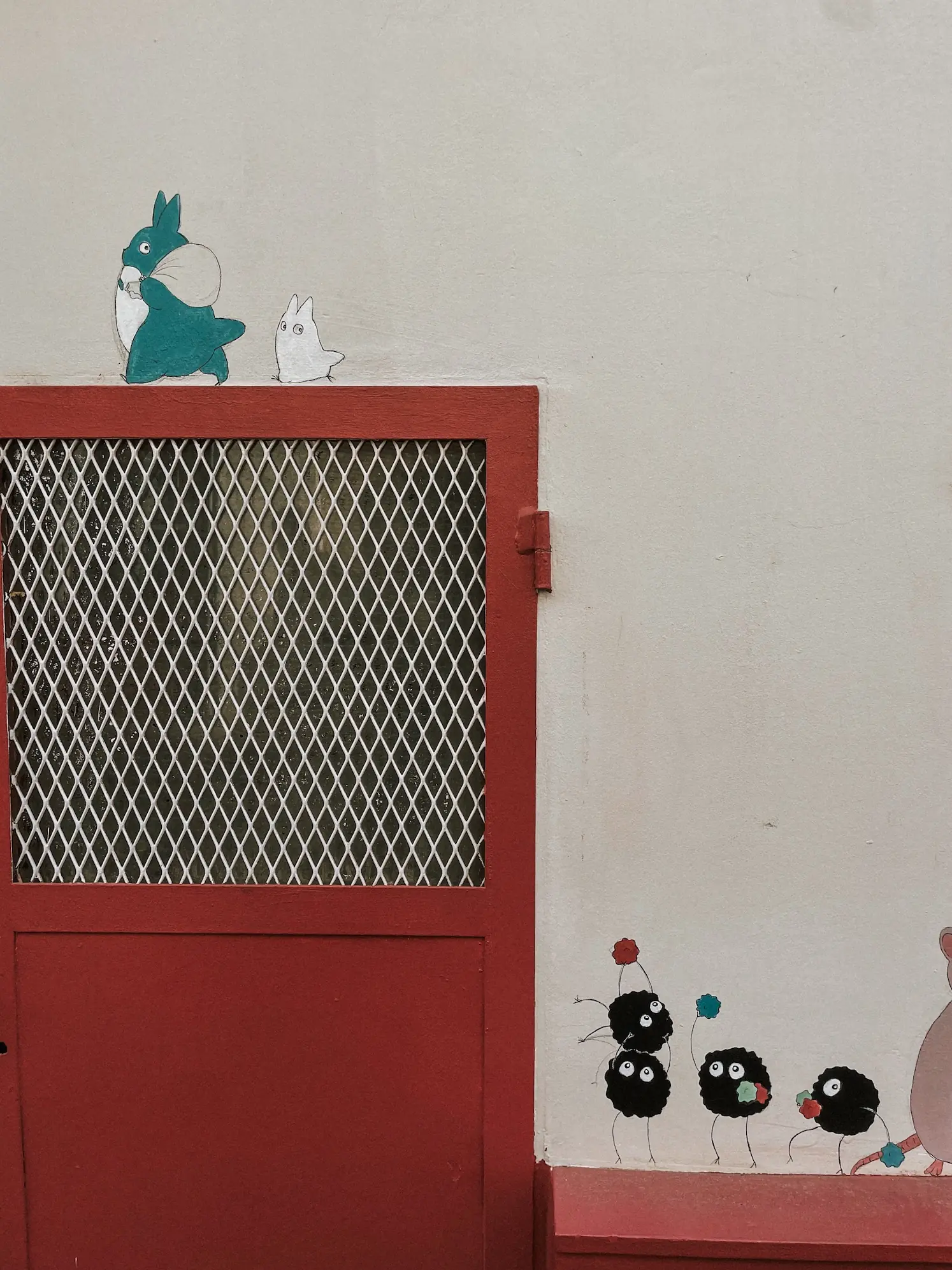 a red door on a white wall