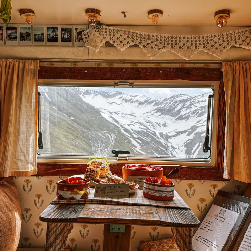 A window table with snow-covered peaks